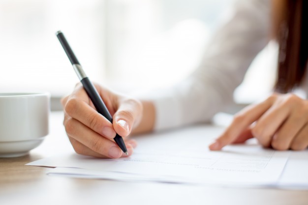woman signing contract